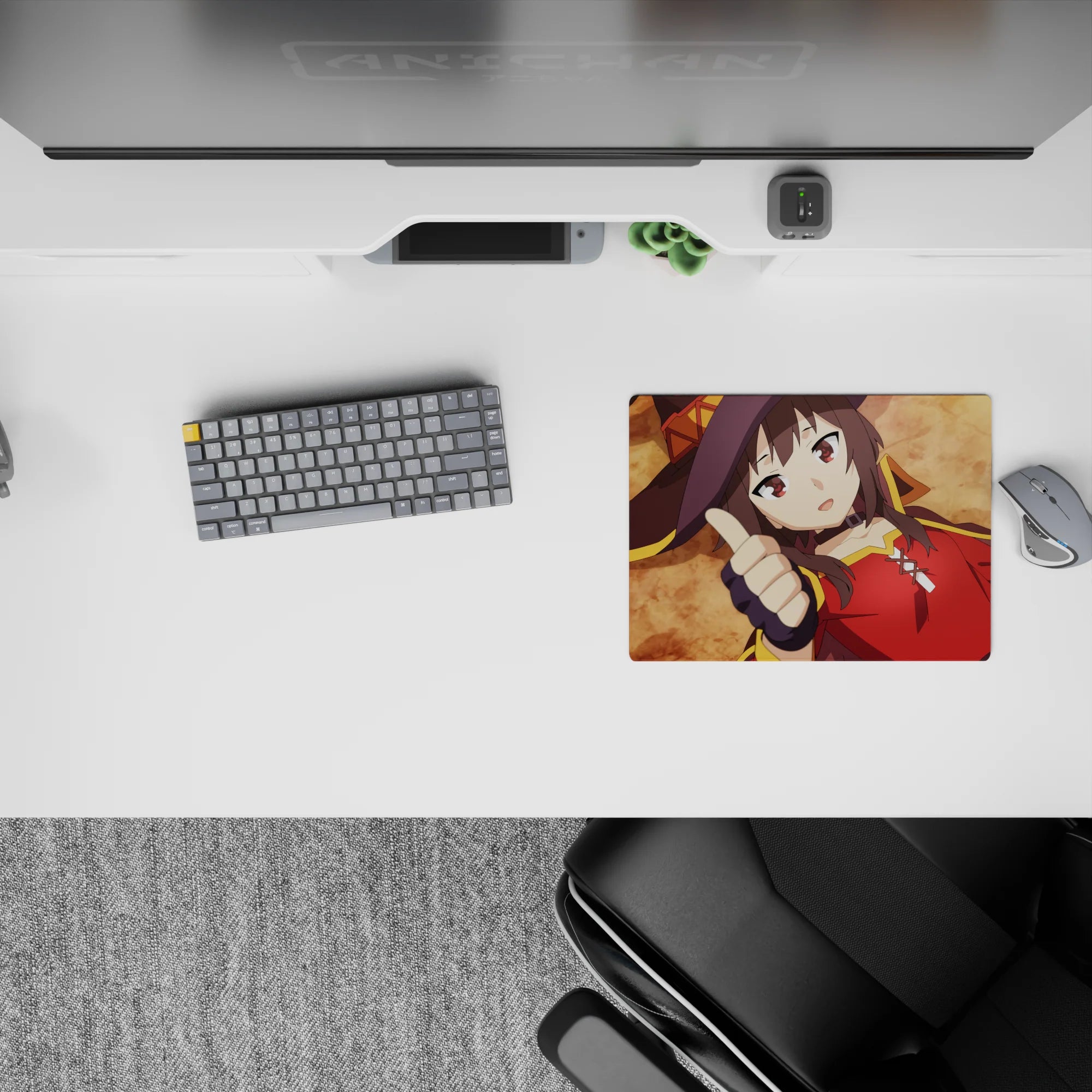 Megumin from KonoSuba anime mouse pad, 14x10 inches, lying flat with thumbs up, crimson cloak and witch hat, humorous vibe.