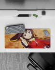 Megumin from KonoSuba lying flat with thumbs up on a 28x12 inch anime mouse pad, vibrant ochre background, crimson cloak.