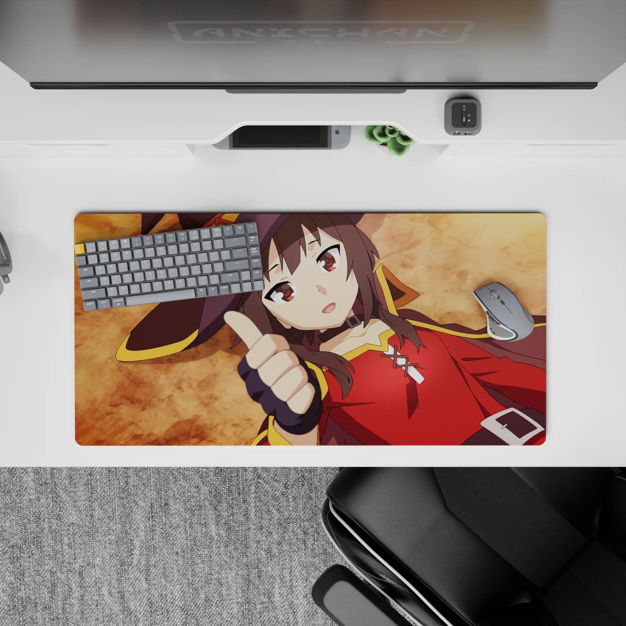 Megumin from KonoSuba on a 32x16 inch anime mouse pad, posing humorously with a thumbs up against an ochre background.