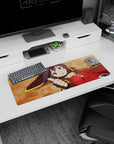 Megumin from KonoSuba anime on a 32x12 inch mouse pad, showcasing her thumbs up in a humorous pose with a vivid ochre background.