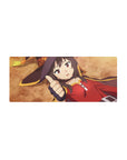 Megumin from KonoSuba on 28x12 inches anime mouse pad, lying on ground with thumbs up, crimson cloak, ochre background.