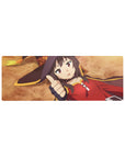 Megumin from KonoSuba anime mouse pad, 32x12 inches, featuring her iconic pose with crimson cloak and witch hat on ochre background.