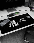 40x20 inches anime desk mat featuring hand-painted white kanji strokes on black like a frozen final panel.