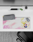28x12 inches anime desk mouse pad in soft pink cotton-candy clouds, airy negative space, bright navy and red accents.