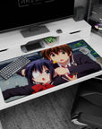 40x20 inches anime desk pad showing eyepatch girl with twin tails and boy with green eyes, surprised.