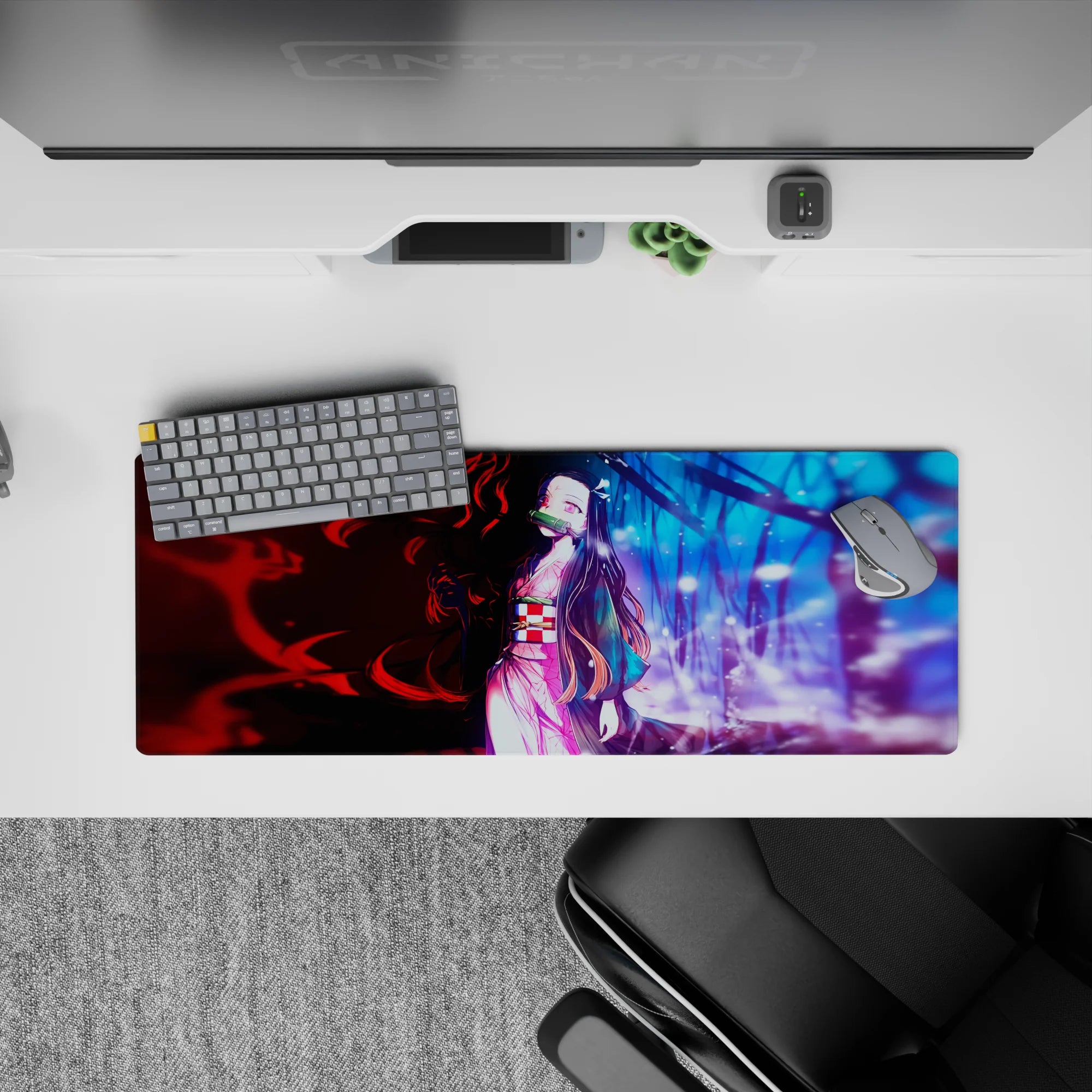 Nezuko anime mouse pad 32x12 inches, features her pink kimono amid red and blue worlds, blending tension and calm.