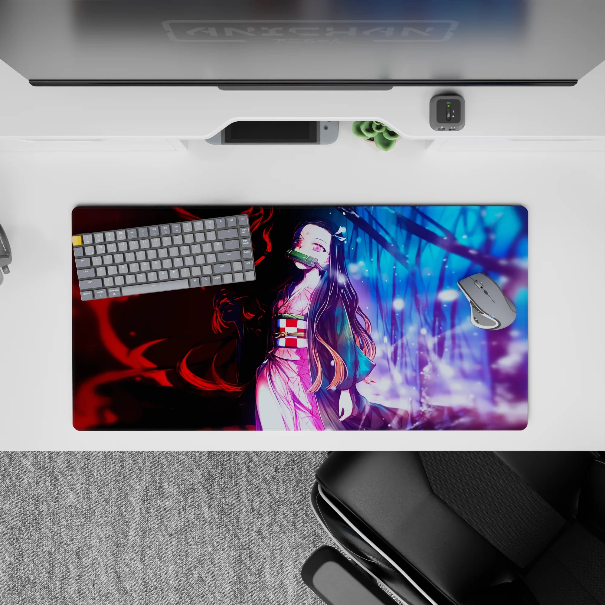 Anime mouse pad 32x16 inches, featuring Nezuko from Demon Slayer. Her pink kimono divides fiery red and cool blue worlds.