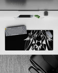High-contrast monochrome anime desk mat with hypnotic poster vibe, 28x12 inches.