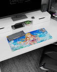 28x12 inches mouse pad featuring a laughing blonde anime girl in a white cover-up with flower ribbon by waves.