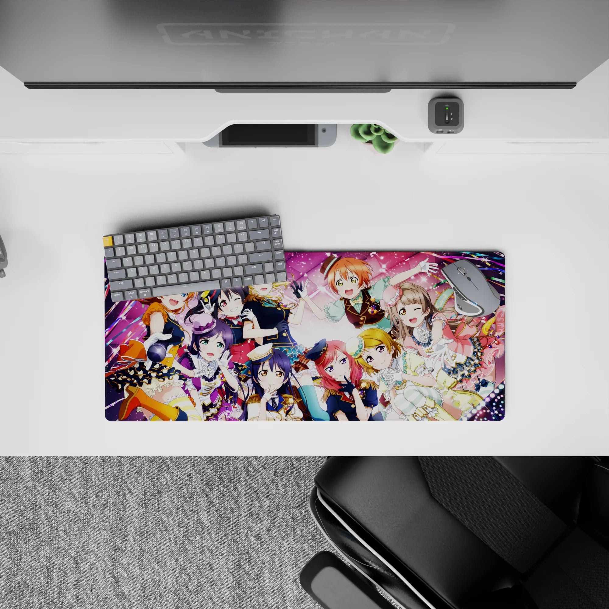 Candy pink anime girl mouse pad 28x12 inches with confetti ribbons and concert stage lights, upbeat vibe.