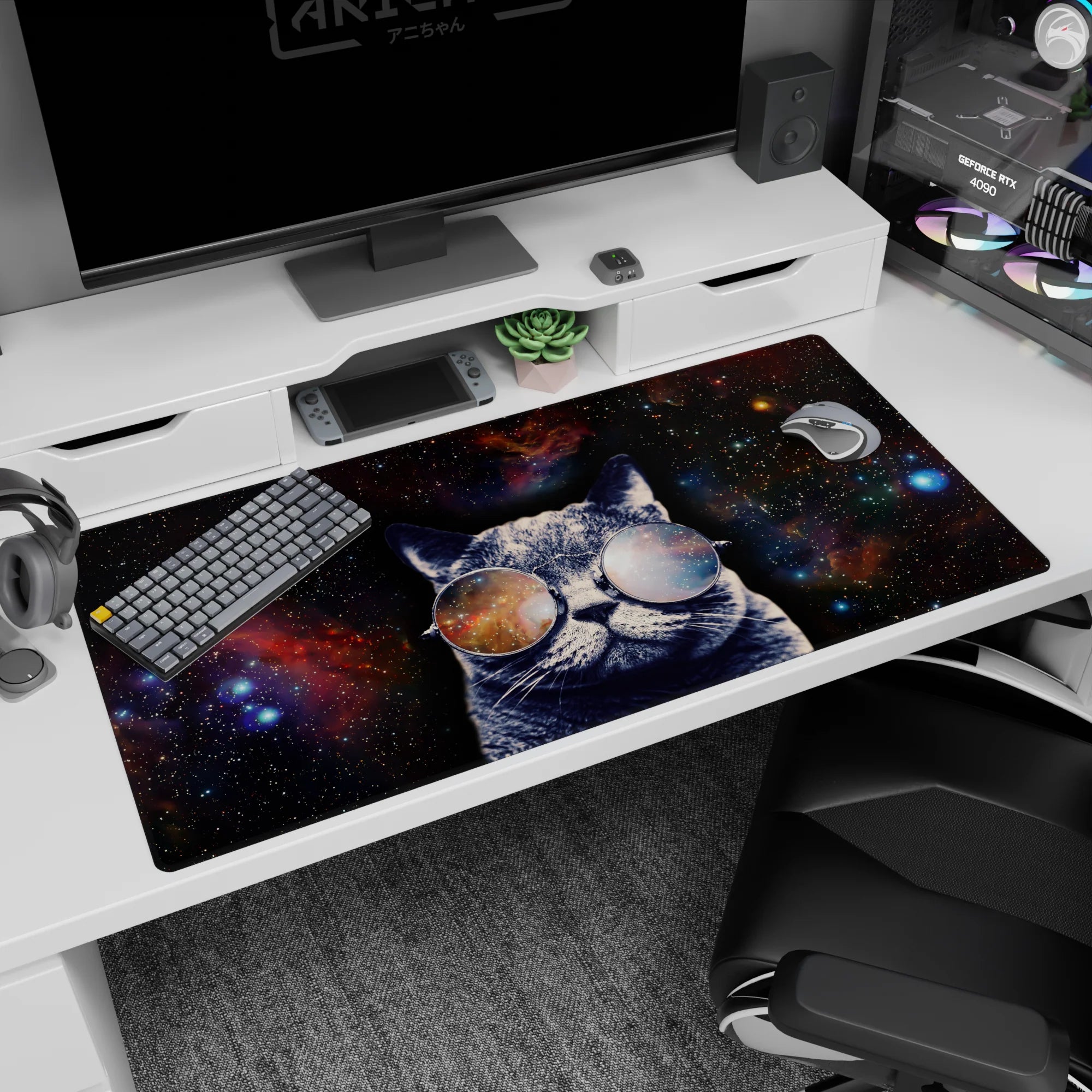 Gray cat in big round glasses against a starry galaxy desk pad 40x20 inches for a playful workspace.