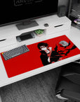 36x16 inches Naruto desk pad featuring Itachi Uchiha staring forward as black crows cut across red.