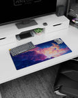 Howl and Sophie floating in a starlit sky on an anime mouse pad 28x12 inches with a giant winged friend.
