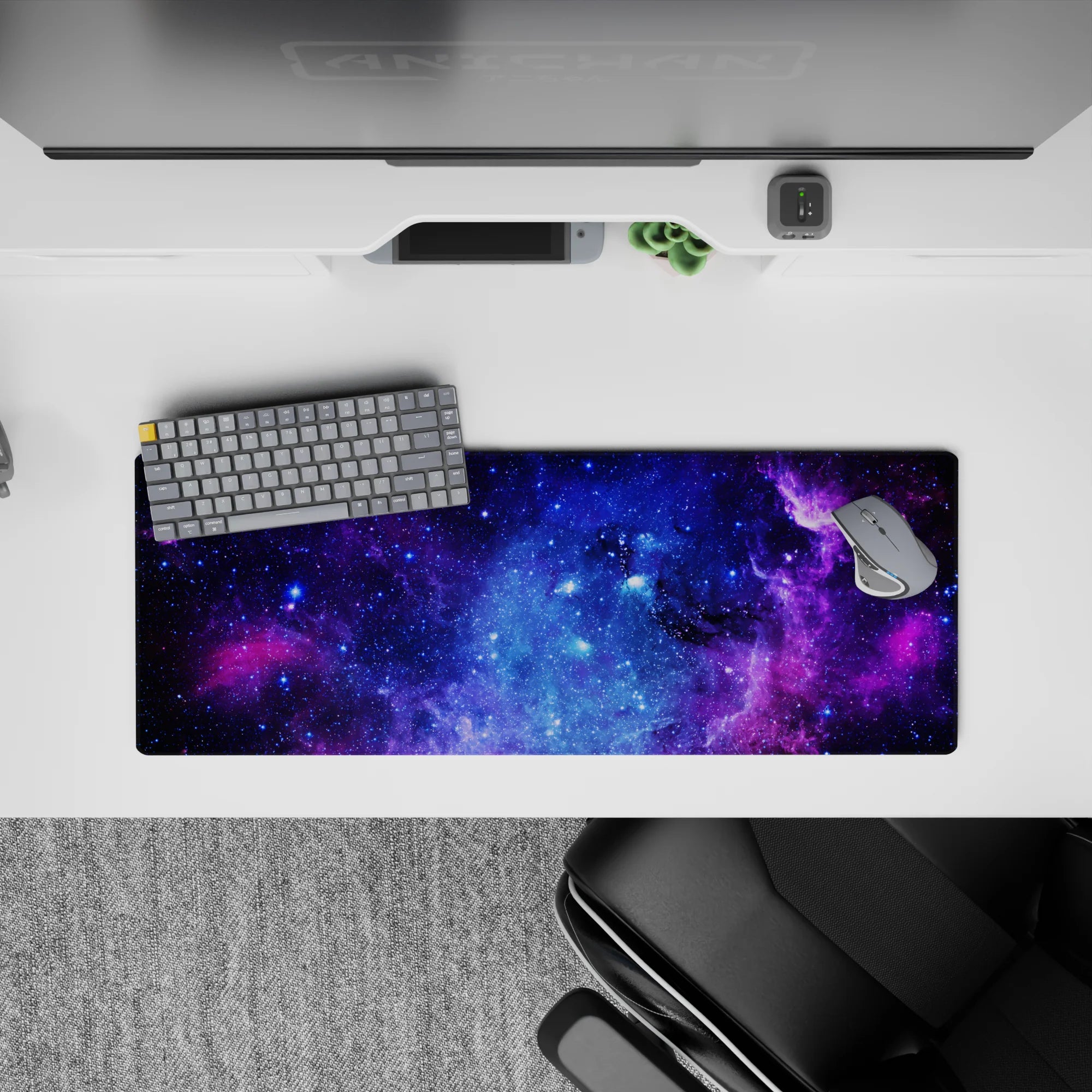 Velvety purple and electric blue cosmic mouse pad, calming night-sky vibe, 32x12 inches.