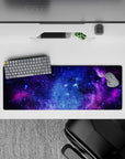 Velvety purple and electric blue cosmic mouse pad, calming night-sky vibe, 32x12 inches.