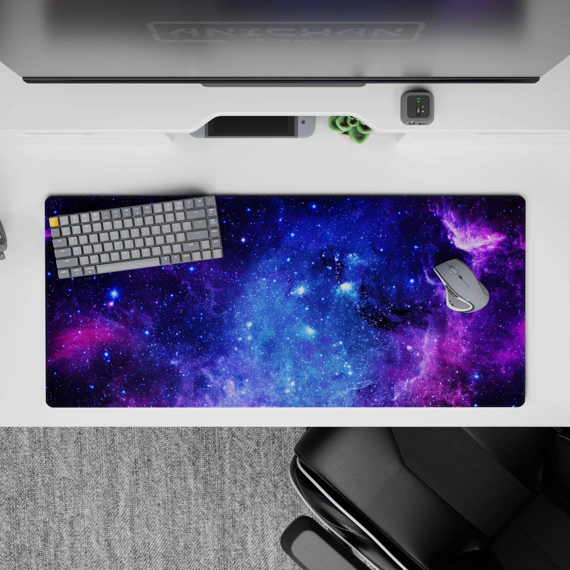 Velvety purple and electric blue cosmic desk pad, 36x16 inches, calming night-sky vibe with stars.