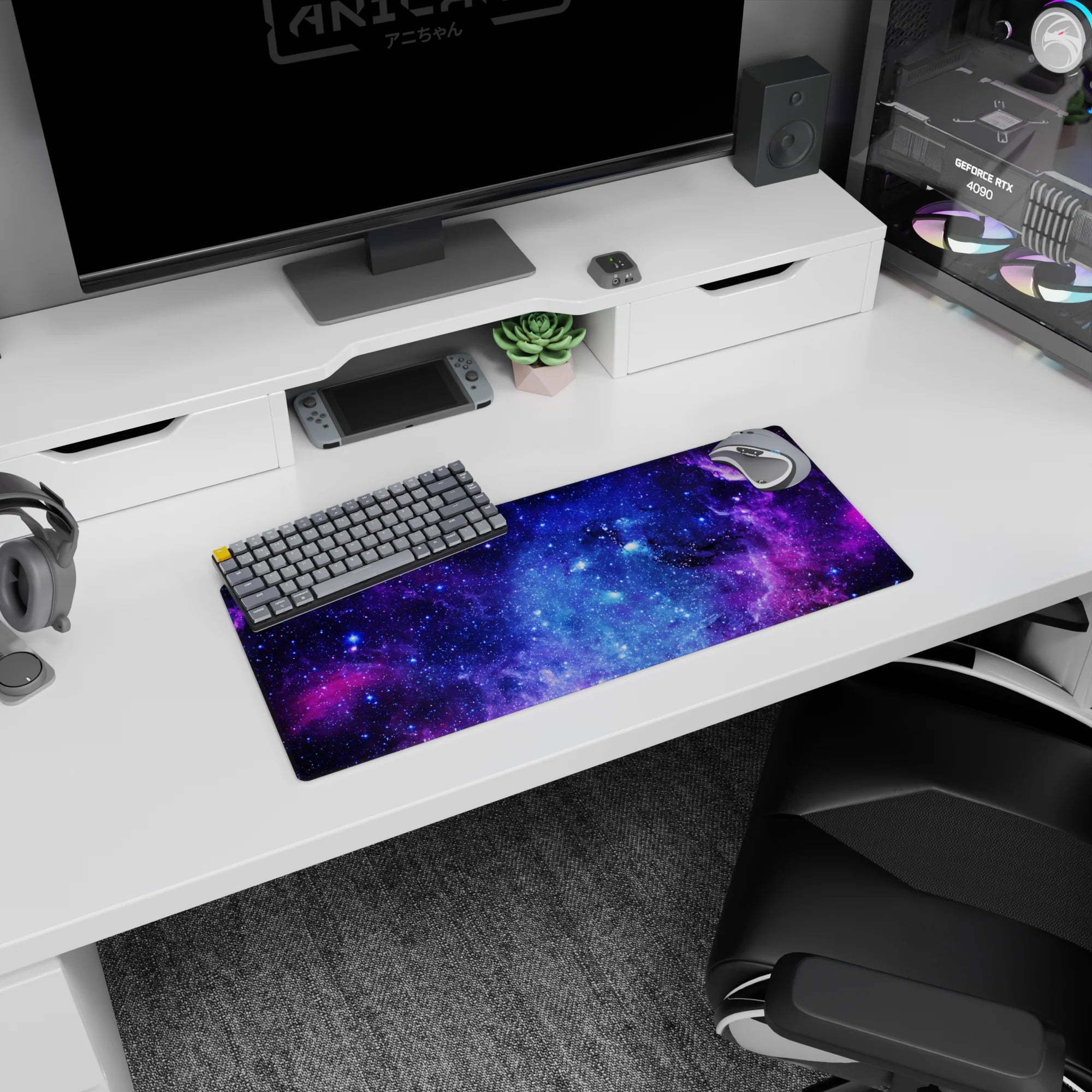 Swirling nebula clouds and tiny stars across a deep-space scene on a 28x12 inches mouse pad.