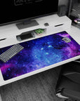 Swirling nebula clouds and tiny stars desk pad 40x20 inches, deep space scene for desktops.