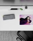 Nezuko from Demon Slayer on 14x10 inch mouse pad, surrounded by sakura petals, captures her fierce yet gentle nature.