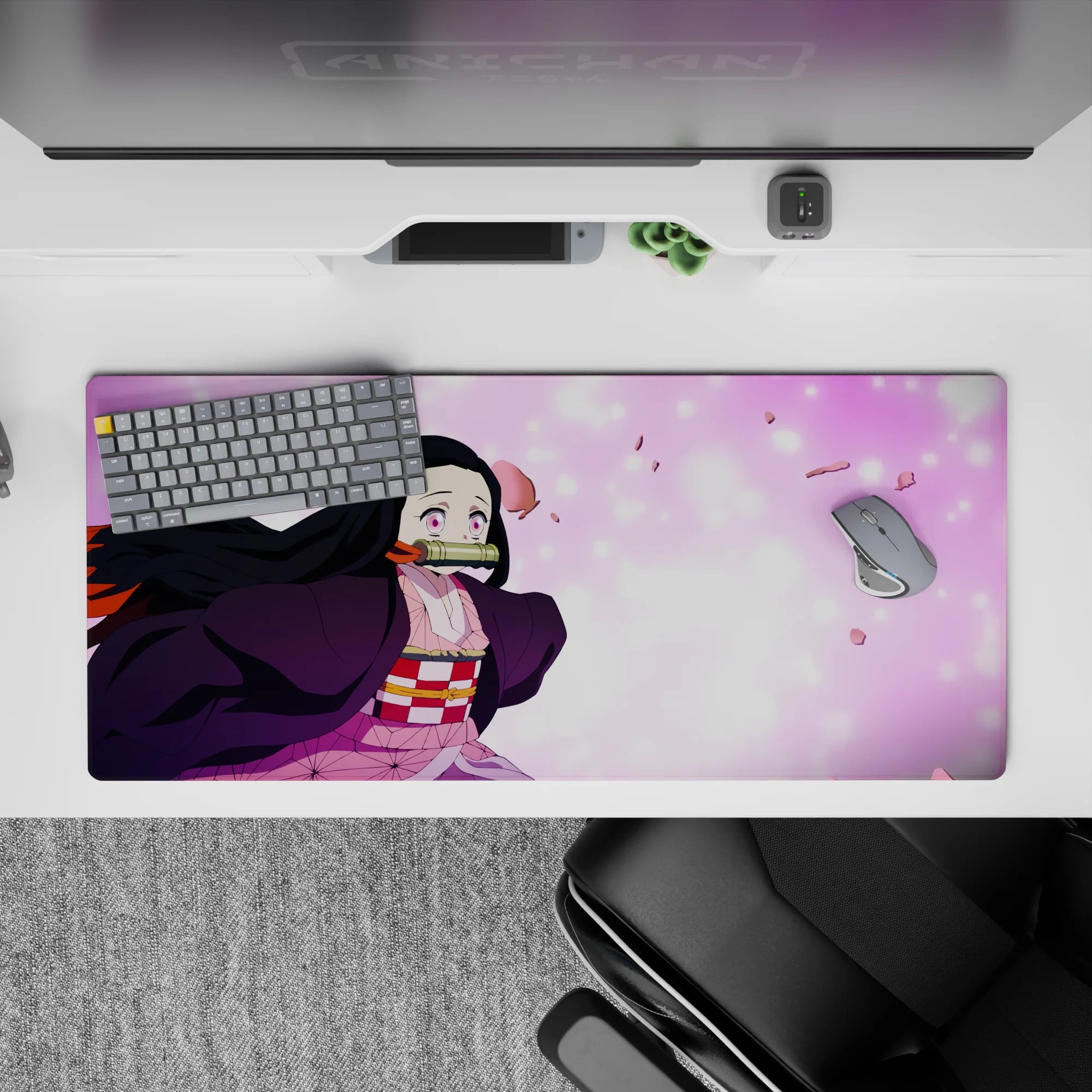 Anime desk pad featuring Nezuko from Demon Slayer, 36x16 inches, with sakura petals and vivid eyes for a vibrant desktop.