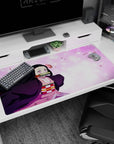 Anime desk pad 40x20 inches with Nezuko from Demon Slayer, featuring sakura petals and pastel tones for a vibrant look.