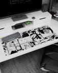 36x16 inches Naruto desk pad showing Naruto and Sasuke in sharp inked panels, manga-style.