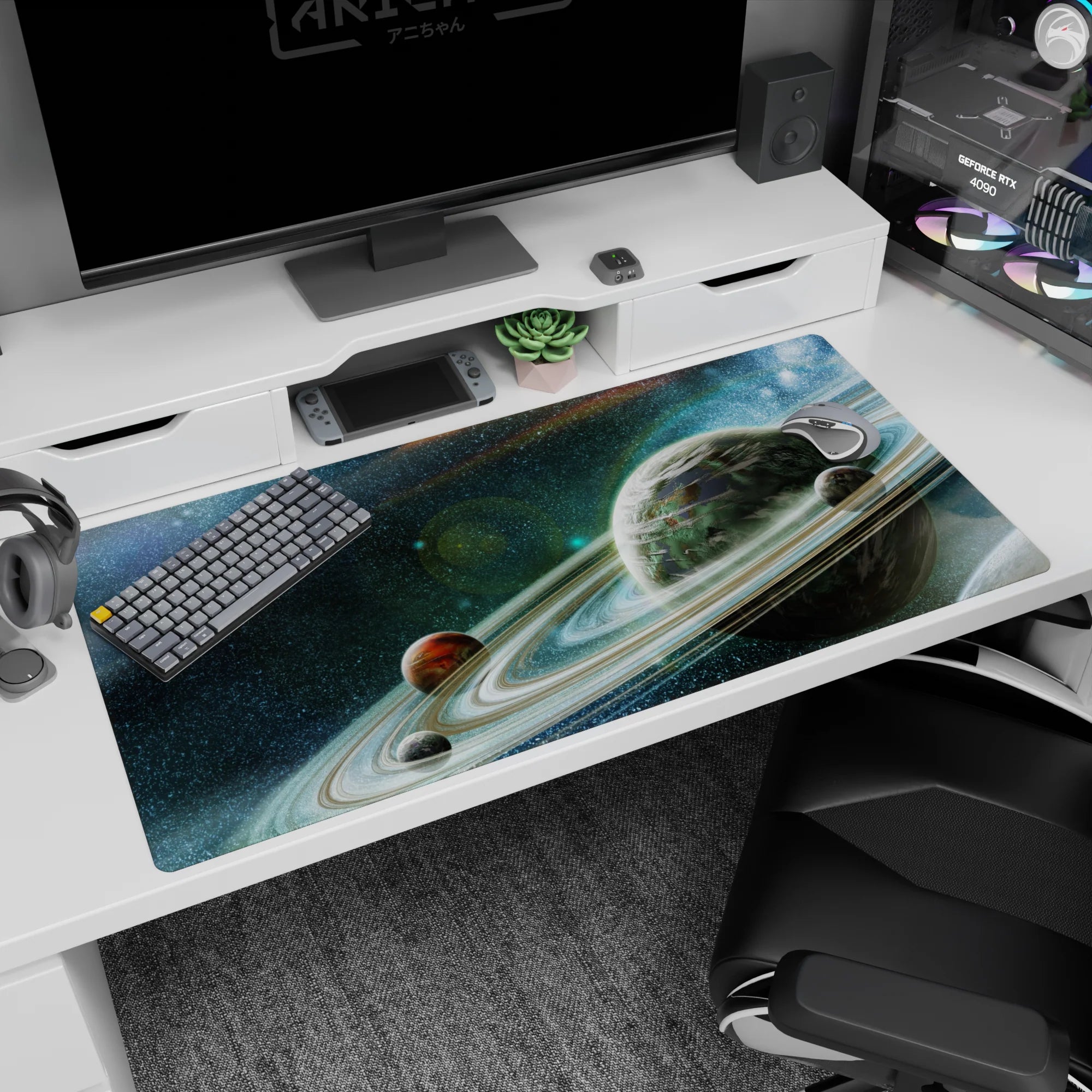 Giant ringed planet cruising through a speckled starfield desk pad 40x20 inches.