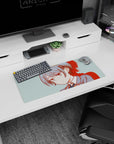 Calm, stubborn-looking anime schoolgirl on mouse pad 28x12 inches, gray-blue hair bow beside keyboard.