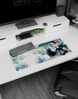 Anime girl mouse pad 28x12 inches showing two schoolgirls holding hands on a leafy school path.