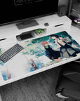 40x20 inches anime girl desk pad showing two schoolgirls hand-in-hand on a tree-lined path, skirts fluttering.