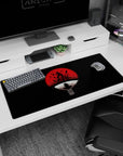 36x16 inches Naruto desk pad featuring Itachi Uchiha perched in a calm crow pose under a red moon.