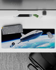 Moody 32x12 inches mouse pad in deep black sky, bright ocean blues, and soft cloud gradients.