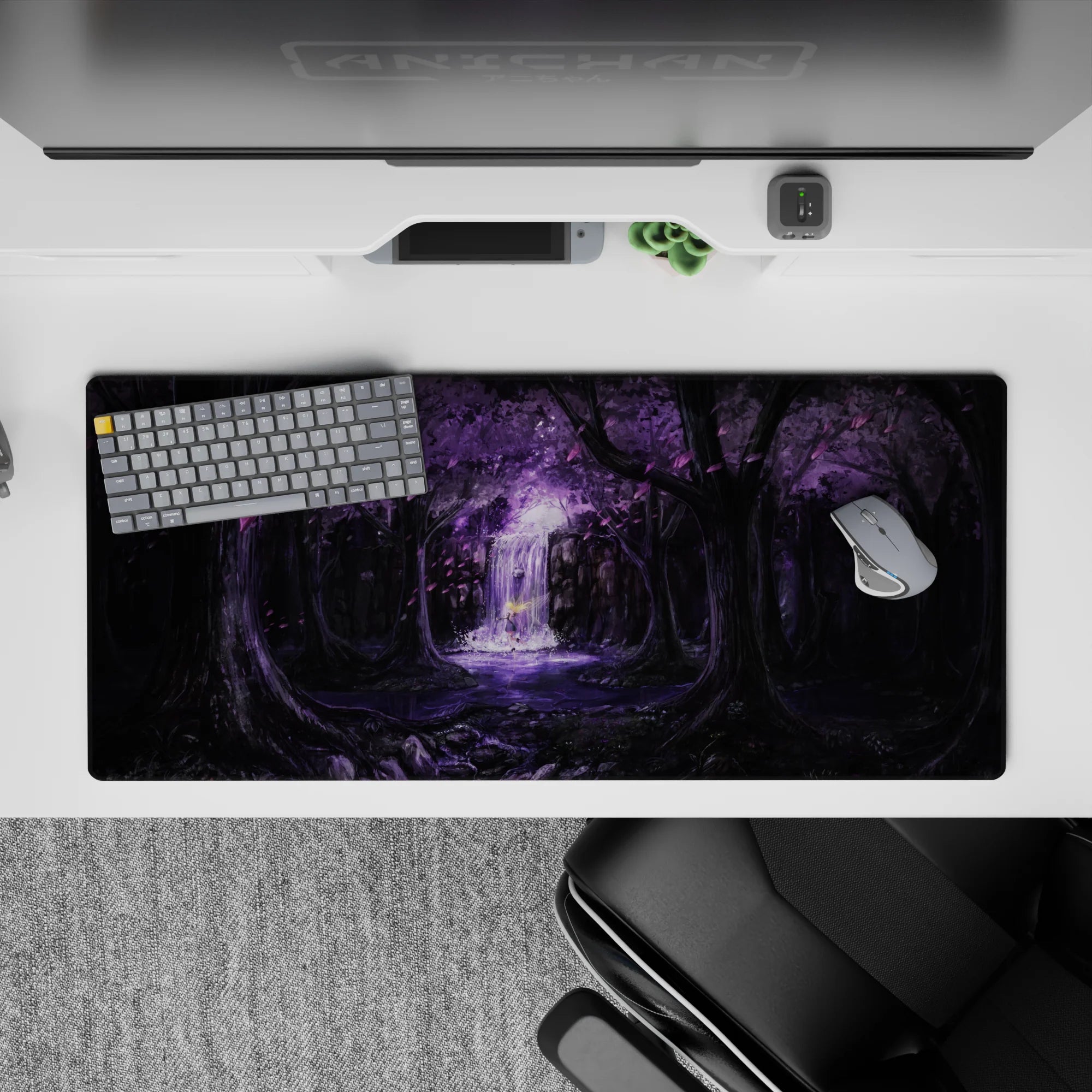 36x16 inches anime desk pad in deep blacks and lavender, dreamy dusk lighting and calming waterfall mist.