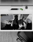 Dark cozy black-and-gray anime girl mouse pad 32x16 inches, dramatic ink hair and sharp cityscape.
