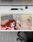 32x16 inches anime mouse pad in warm peach and blush pink, calming romantic vibe with drifting sakura.