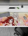 Romantic peach-pink anime desk pad 36x16 inches with soft blush gradients and floating cherry blossoms.
