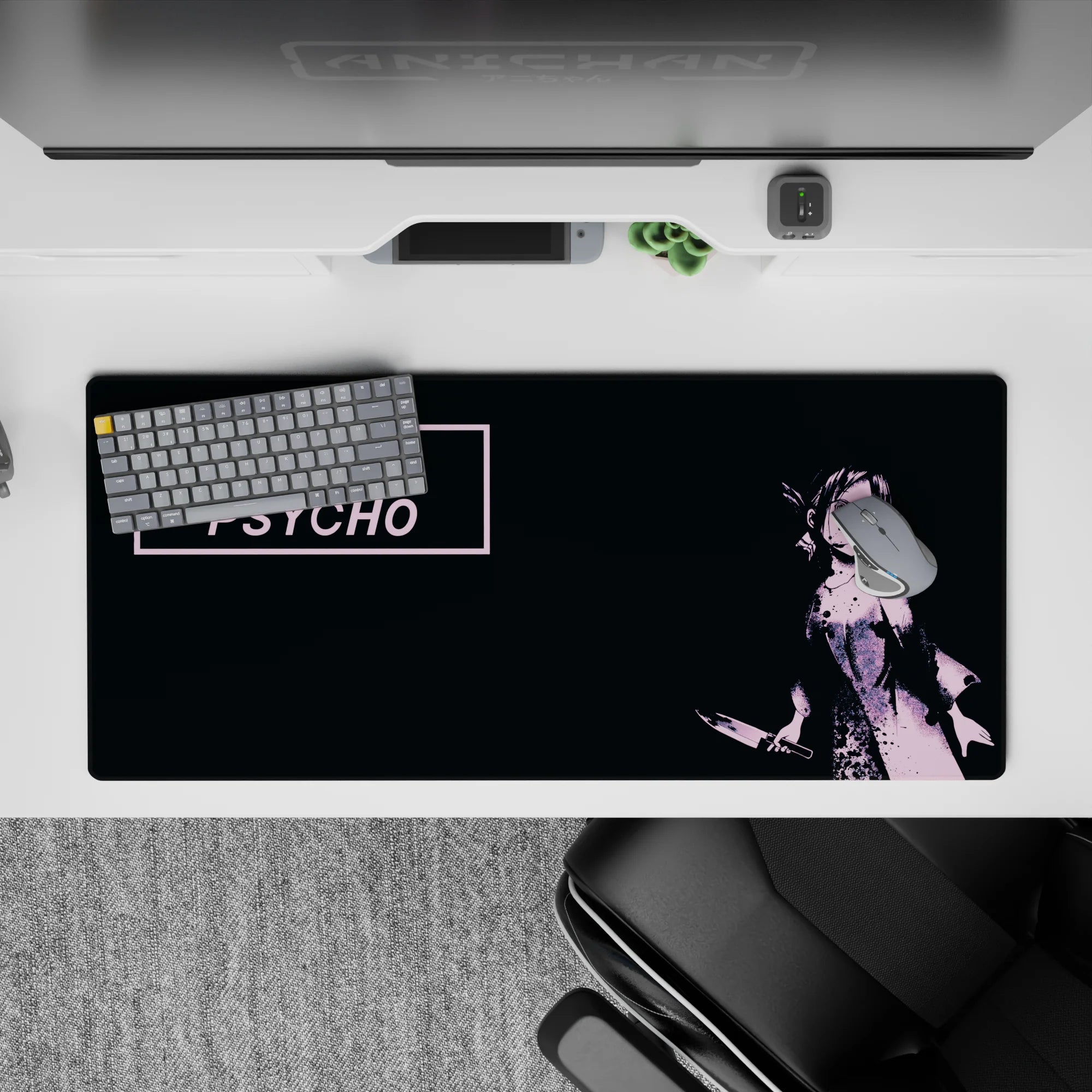 Pink and black 36x16 inches anime desk pad with moody mischievous vibe and gritty vintage ink splatter.