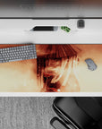 Warm sepia smoke clouds and soft gradients anime desk pad with vivid red eye accents, 36x16 inches.
