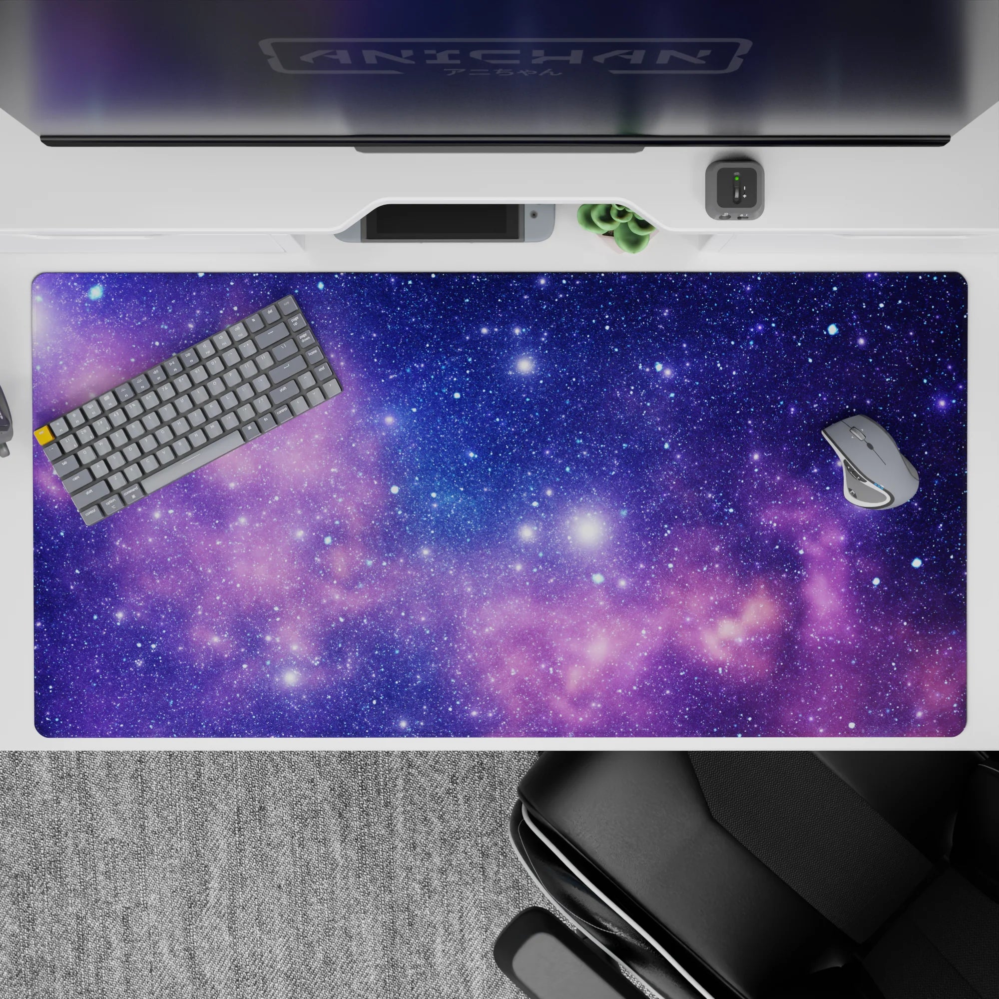 Calm dreamy 40x20 inches desk pad in deep purple with soft pink nebula clouds and sparkling stars.