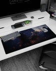 Silver-haired anime girl sprinting with blade, red ribbons flying beside horned samurai desk pad 36x16 inches.