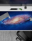 Deep ocean blue desk pad 40x20 inches with dreamy star specks and warm creamy galaxy center.
