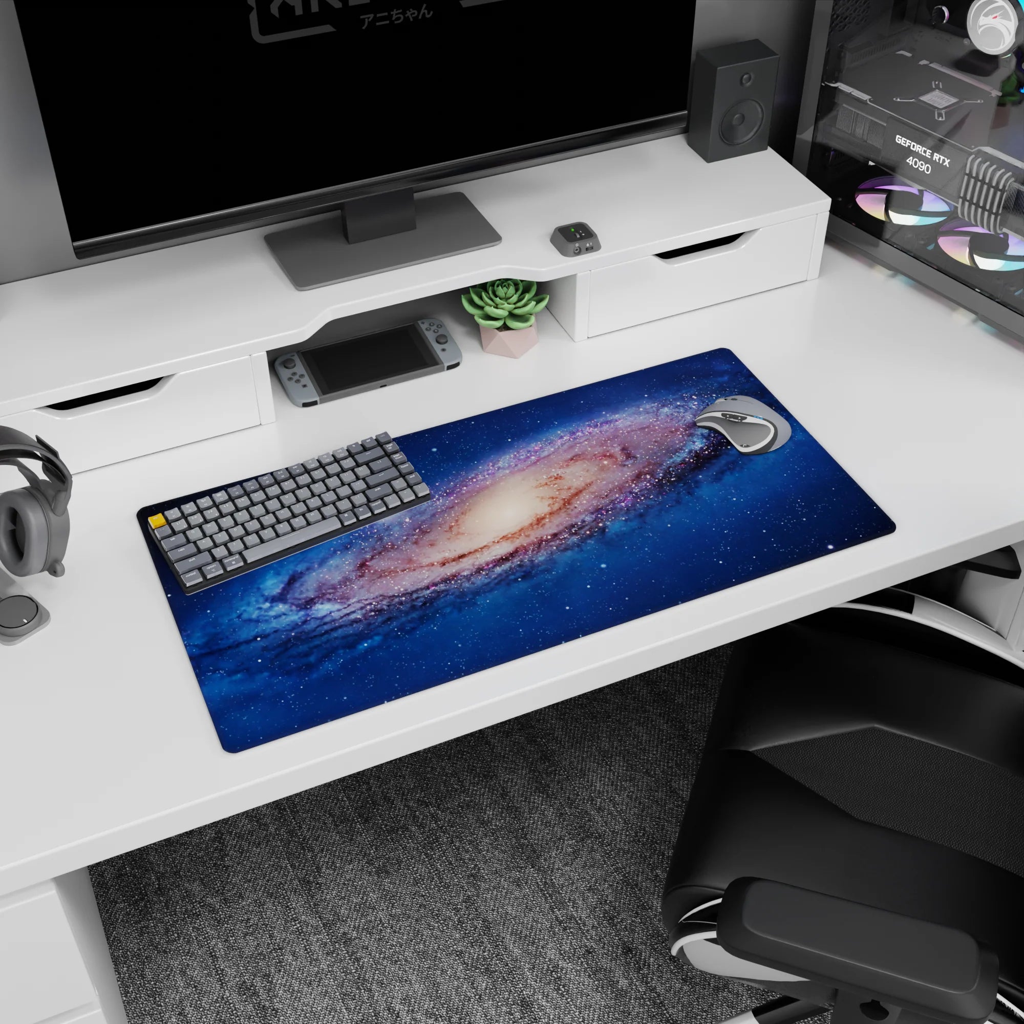 Star-sprinkled spiral nebula scene on a 32x16 inches mouse pad, galaxy swirl drifting underhand.