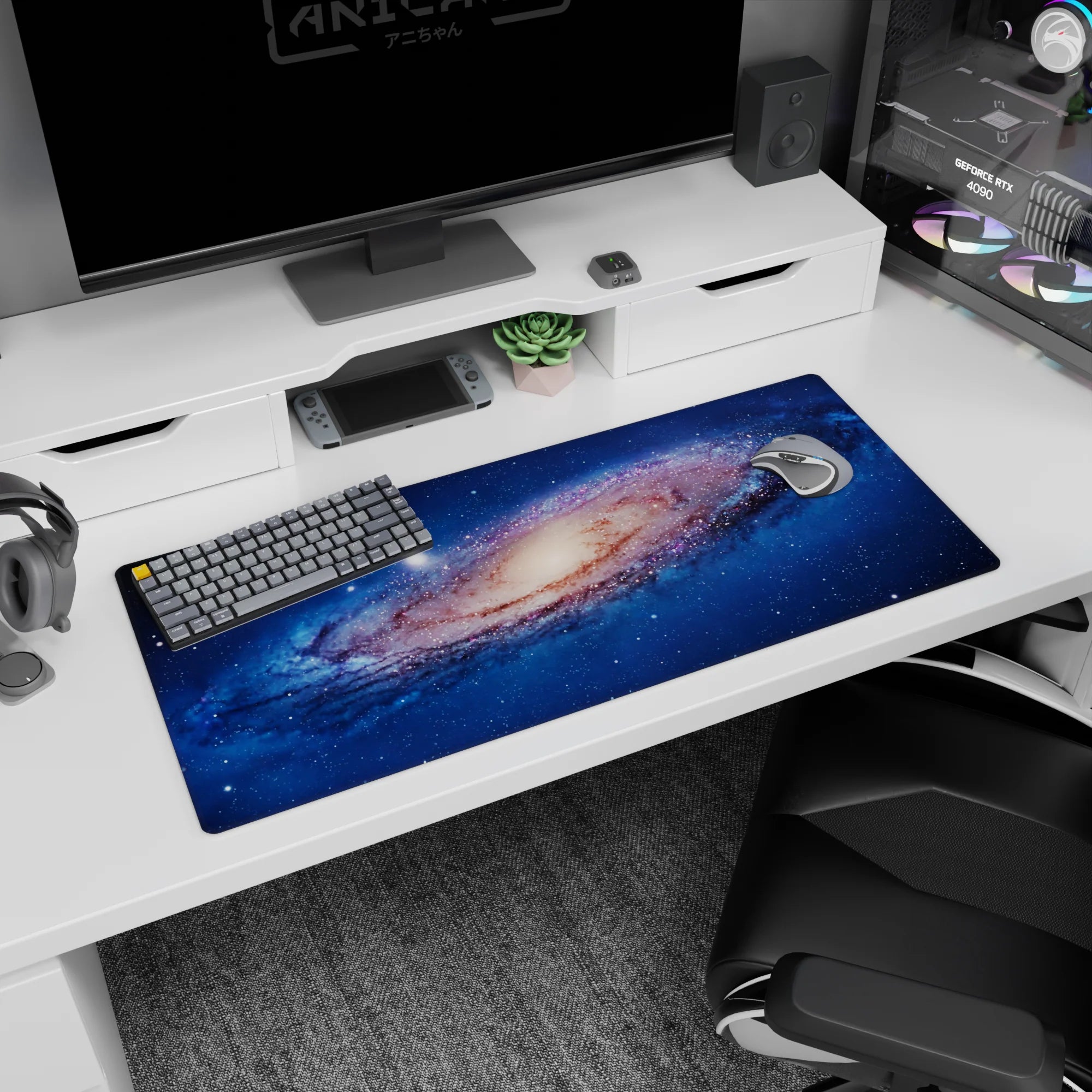 Space vortex scene desk pad 36x16 inches featuring a swirling galaxy center and scattered starlight.