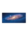 Galaxy spiral desk mouse pad 28x12 inches with star-speckled swirl design and creamy core.