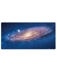 Cosmic spiral galaxy desk mouse pad, 32x16 inches, with starry specks and dreamy swirl design.