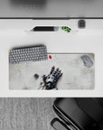 28x12 inches anime mouse pad in soft gray steel and white, quiet sci-fi melancholy with a glowing red accent.