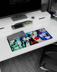 Anime mouse pad 28x12 inches featuring Persona 3's Makoto, Aigis, and SEES team in a vivid grid with cool blues and deep shadows.