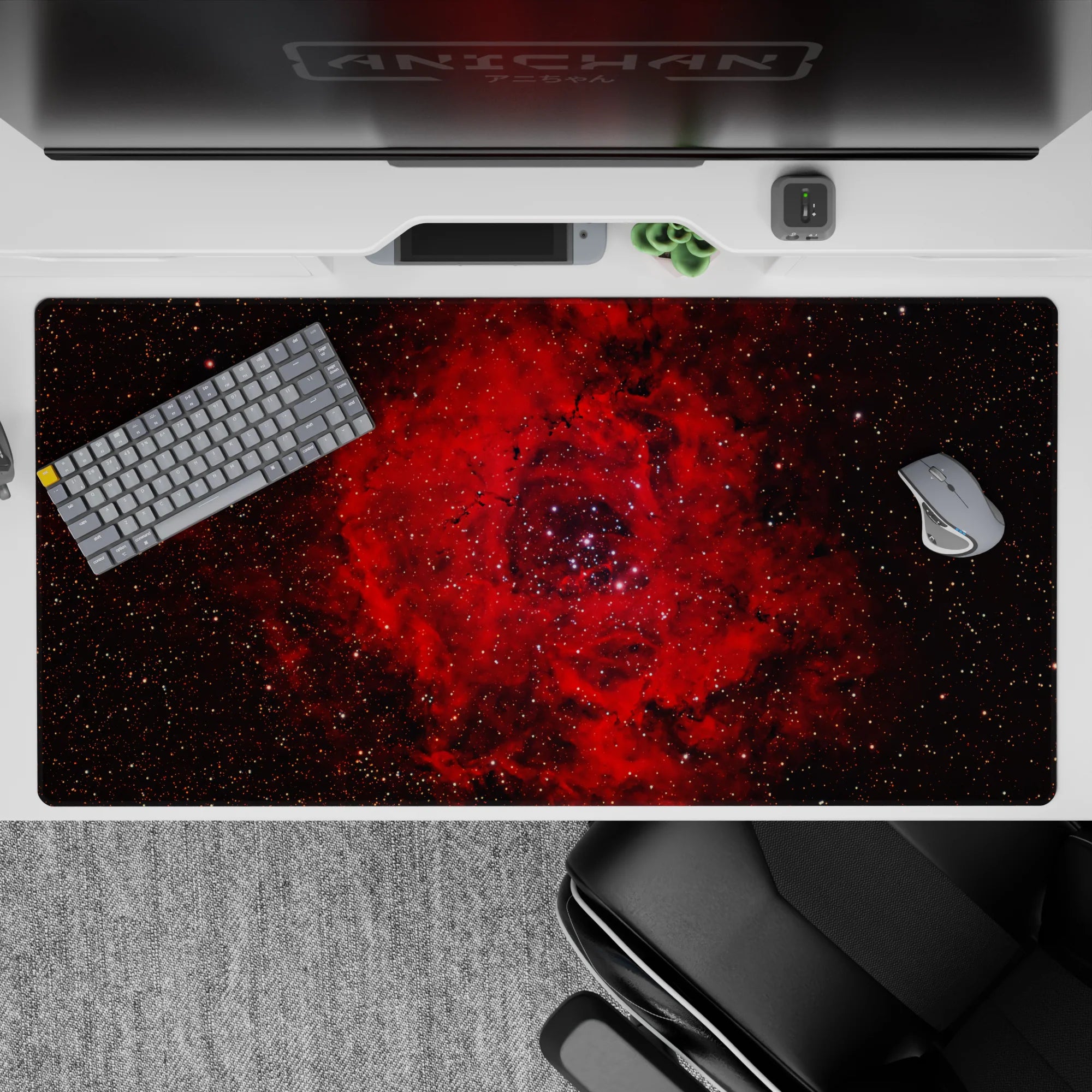 Moody 40x20 inches desk pad in inky black with deep crimson clouds and speckled stardust for late nights.