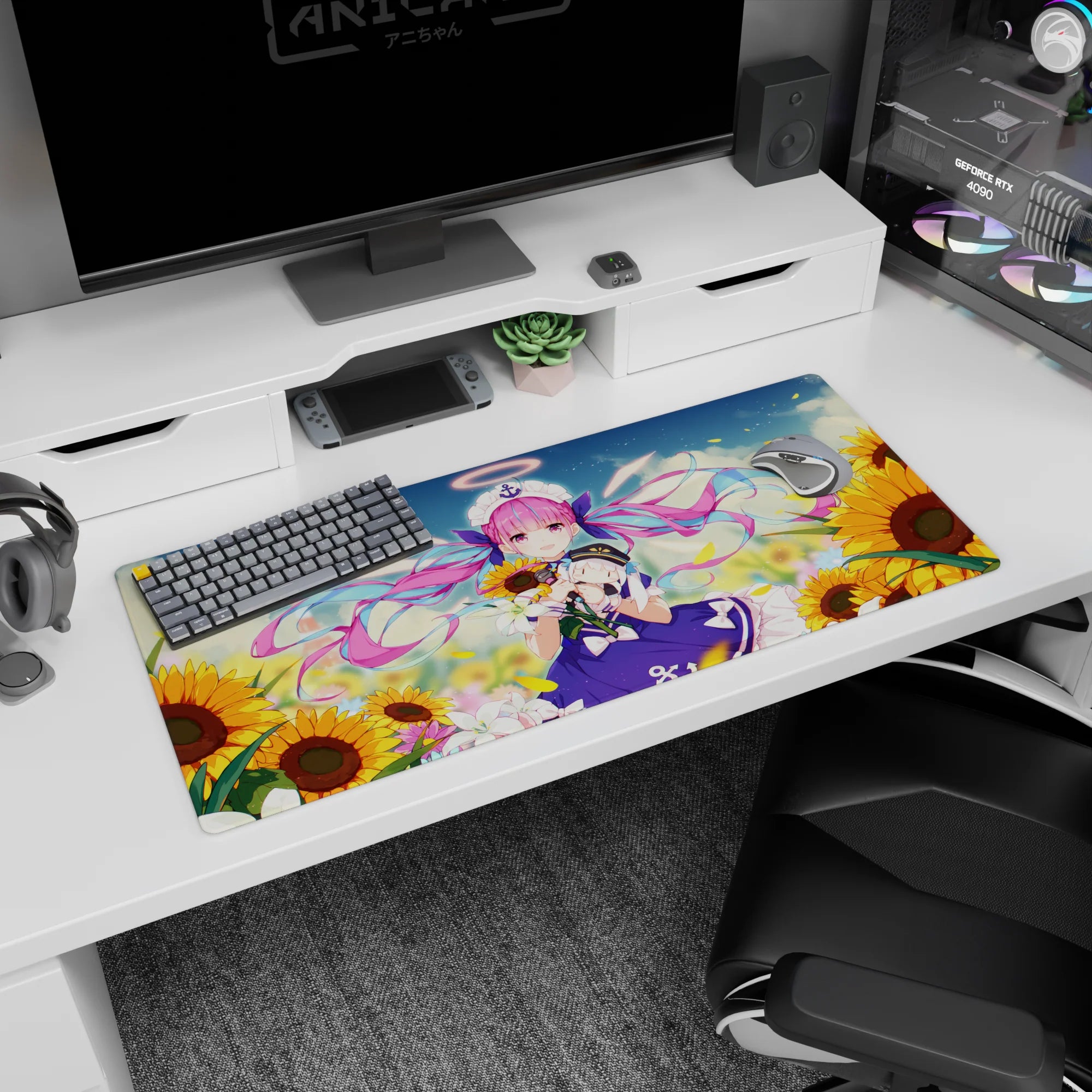 36x16 inches anime girl desk pad showing pink twin-tail sailor girl by sunflowers, petals drifting under blue sky.