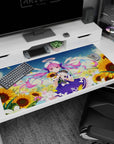 Cute idol-style anime girl desk pad 40x20 inches, twin-tails sailor outfit amid drifting petals and sunflowers.